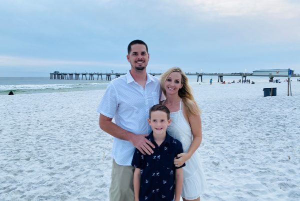 Desiree Easley stands on the beach with her husband, Derrick, and son, Luke.