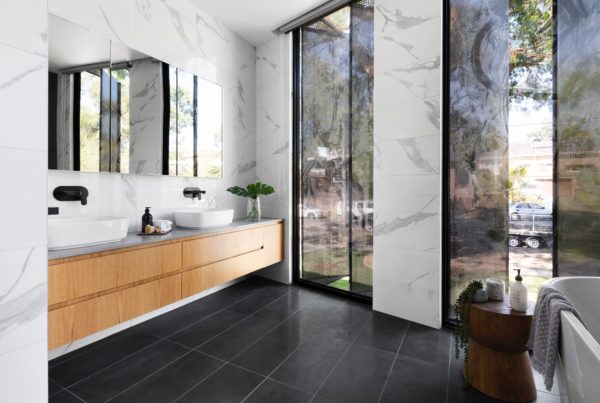 Marble and wood bathroom with windows